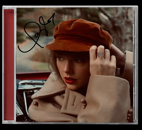 Taylor Swift ký trên đĩa CD Album